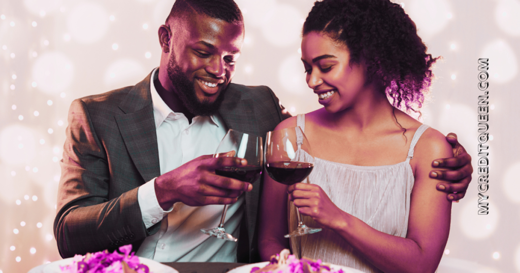 Ethnic couple celebrating financial milestones at dinner