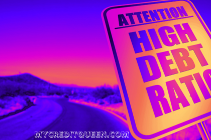 Attention High Debt Ratio sign in purple pink and orange with highway road in the background.