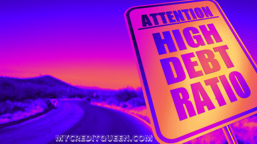 Attention High Debt Ratio sign in purple pink and orange with highway road in the background.