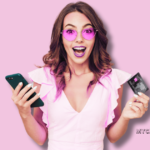 woman holding credit card and cell phone looking surprised