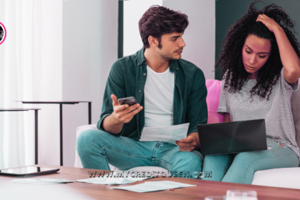 A caucasian man and an ethnic woman with curly hair review their bills in frustration. Paying minimum payment each month.